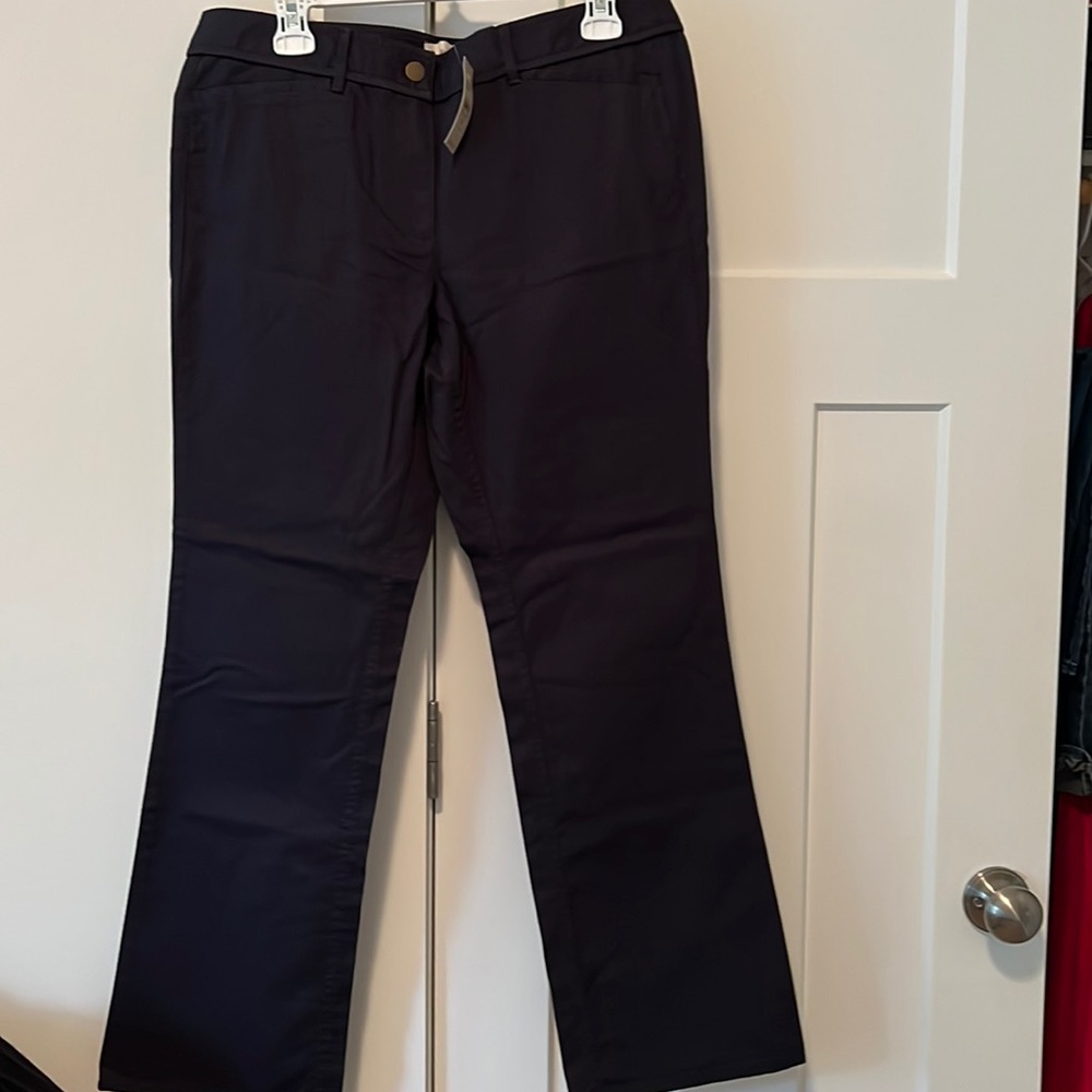 Never worn, navy boot, cut pants